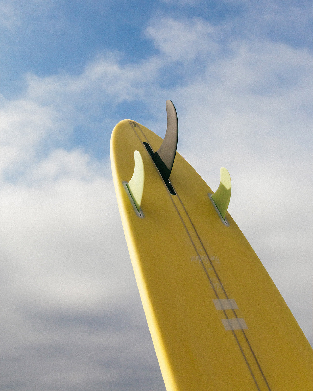 Indio Trim Machine surfboard showing the included fins